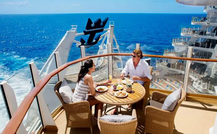 couple dining in the balcony of a cruise ship