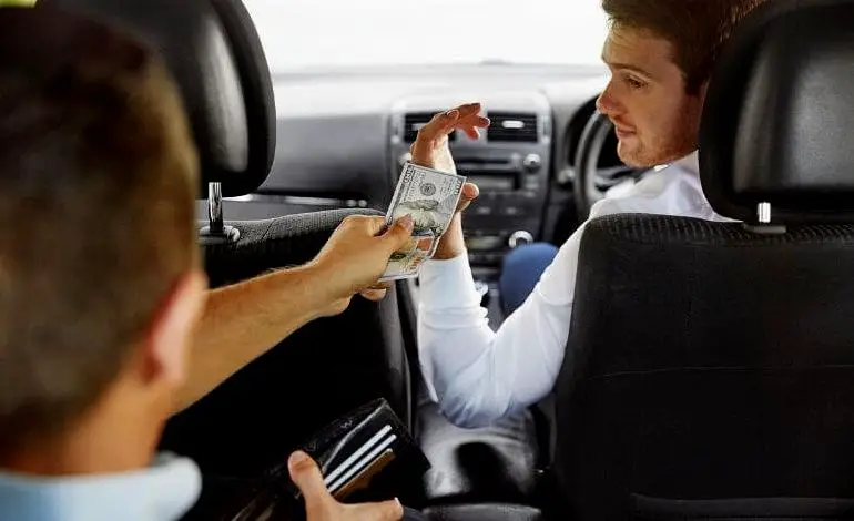 paying-for-taxi-with-cash-1